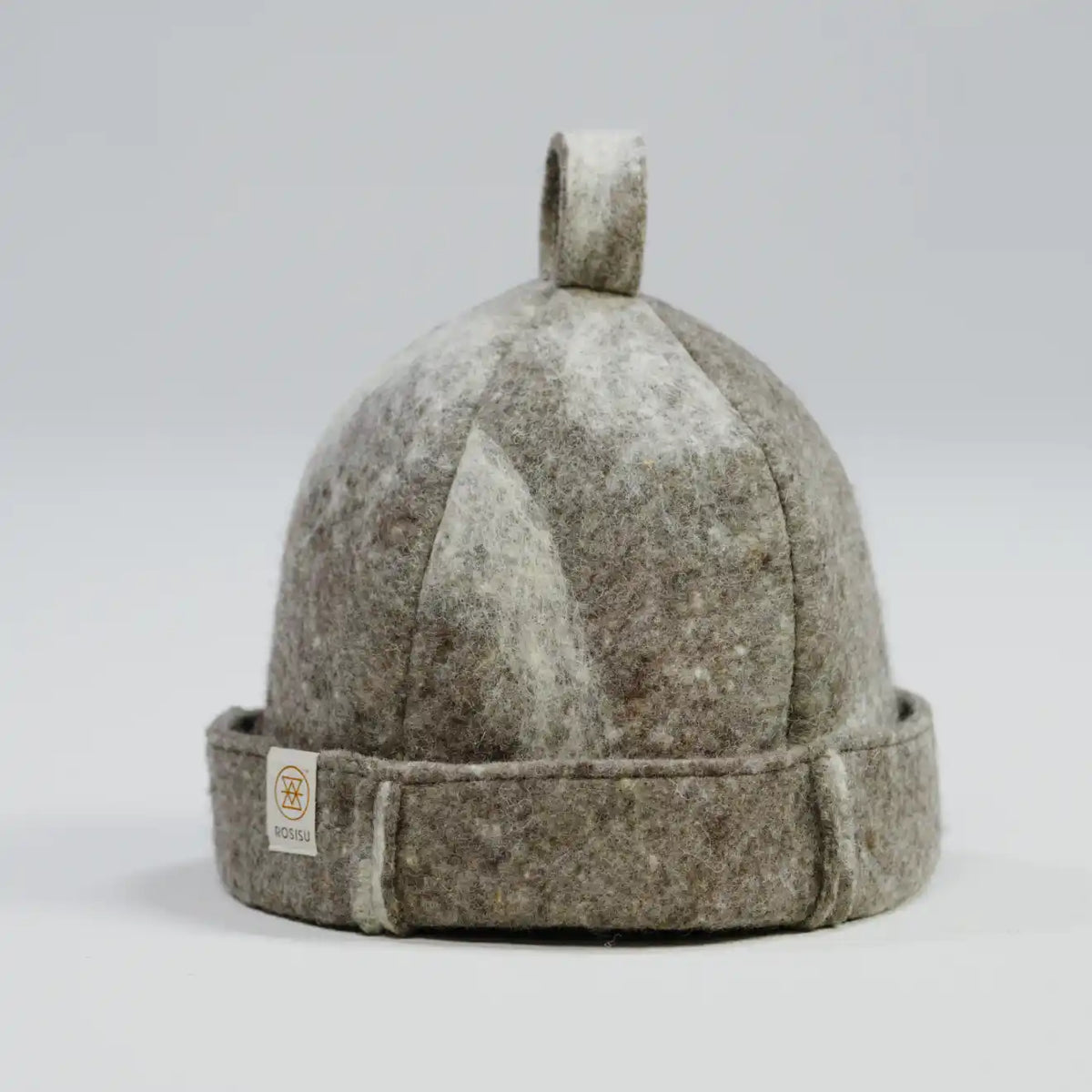 A dome-shaped felt hat in a mottled gray and white colorway, featuring a fold-over brim with a small brand tag and a top loop.